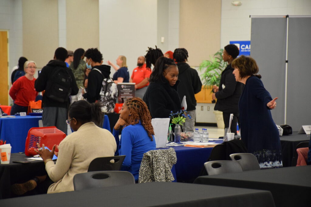 Photo of Job Seekers speaking with vendors