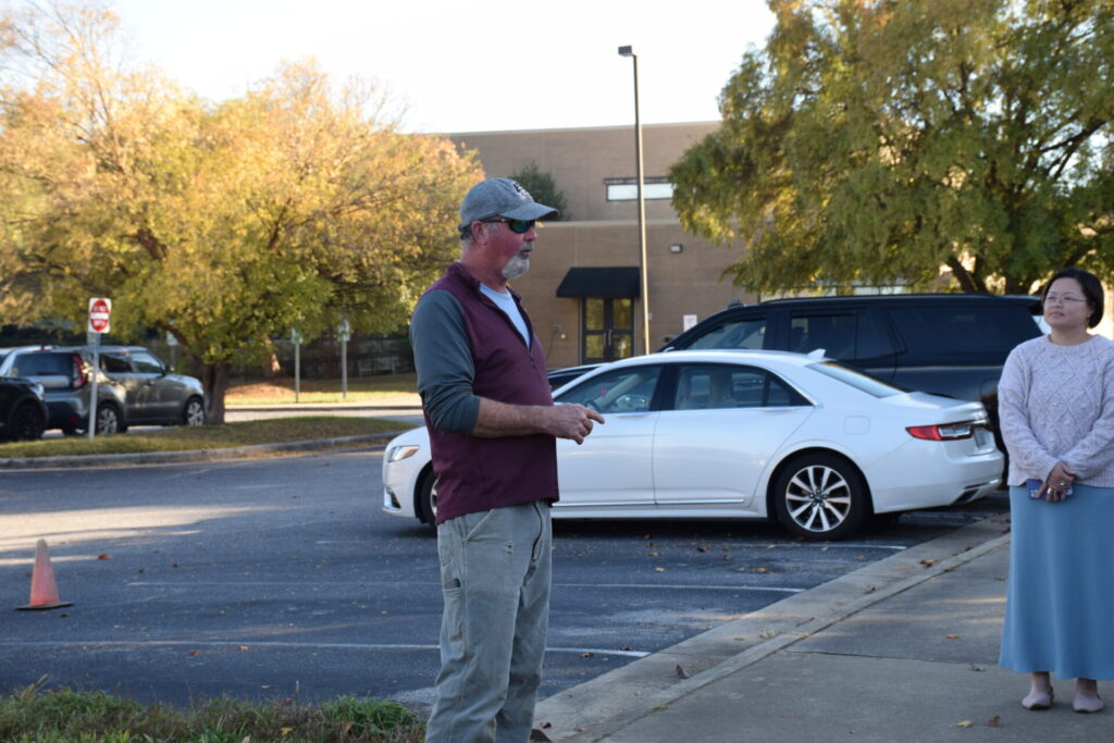 photo of Ken White educating attendees about the tree selected.