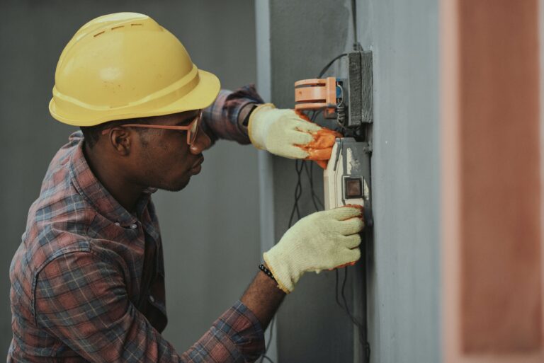 Electrician installing box